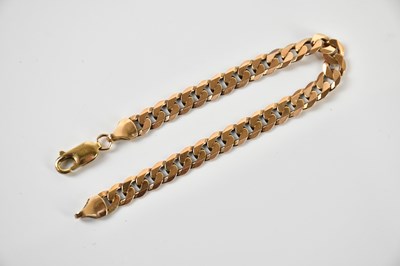Lot 243 - A 9ct yellow gold curb link bracelet, length...