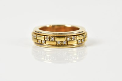 Lot 1374 - An 18ct yellow gold diamond set broad band...