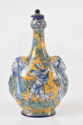 Lot 2766 - A MONTAGNON; a French faienceware lidded flask...