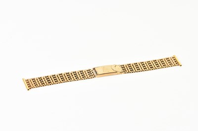 Lot 1845 - A 9ct yellow gold textured watch strap, length...