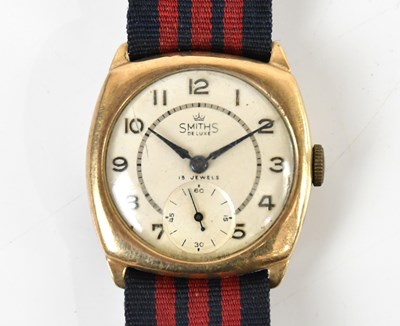 Lot 1886 - SMITHS; a gentleman's 9ct gold cased trench...
