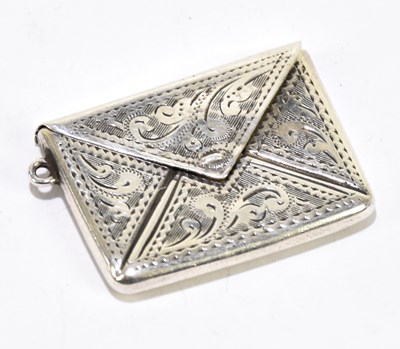 Lot 1195 - A sterling silver engraved envelope stamp case