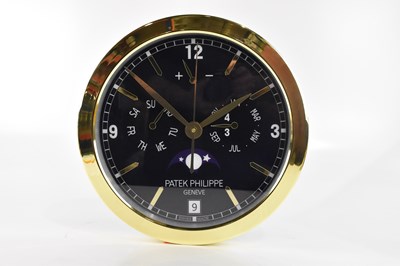 Lot 2484 - A 'Patek Philippe' dealer's display wall clock,...