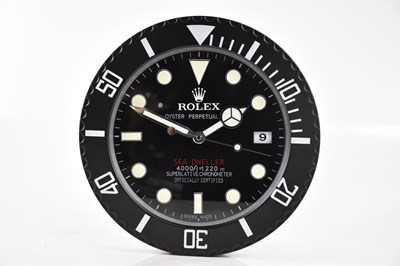 Lot 2485 - A 'Rolex' dealer's display wall clock modelled...