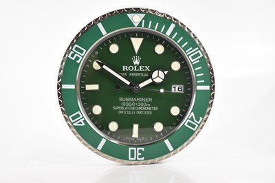 Lot 2486 - A 'Rolex' dealer's display wall clock modelled...