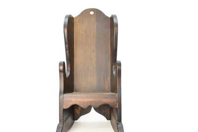 Lot 61 - A child's 19th century stained pine rocking...