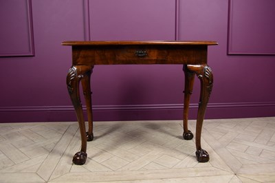 Lot 2330 - An Irish style walnut side table, with...