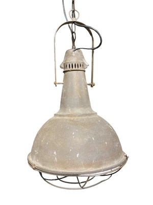Lot 2653 - A pair of industrial ceiling lights, with cage...