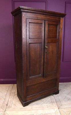 Lot 2249 - An oak tack or livery cupboard, with two...