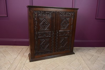 Lot 2275 - A 19th century carved oak hanging cupboard...