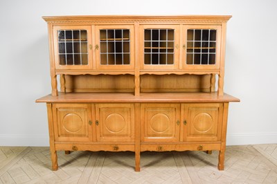 Lot 2250 - An Arts and Crafts light oak dresser, with...