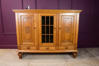 Lot 2264 - A French carved light oak cabinet, with a...