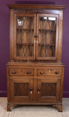 Lot 2242 - An early 19th century oak display cabinet,...
