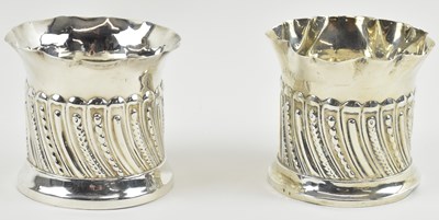 Lot 1198 - Two London hallmarked silver gadrooned vases...