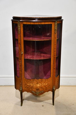 Lot 1075 - A reproduction serpentine fronted vitrine with...