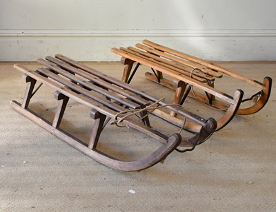 Lot 2478 - Two vintage wooden sledges (2).
