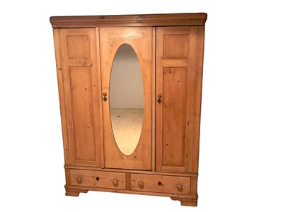 Lot 2389 - A Victorian pine three door wardrobe, with two...