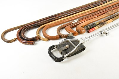 Lot 2556 - A collection of walking sticks including...