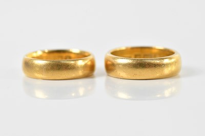 Lot 1301 - Two 22ct yellow gold wedding bands, size K and...