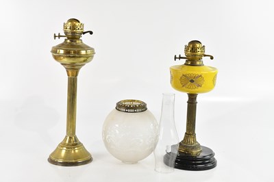Lot 2654 - A late Victorian oil lamp with yellow glass...