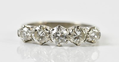 Lot 1300 - An 18ct white gold and graduated five stone...