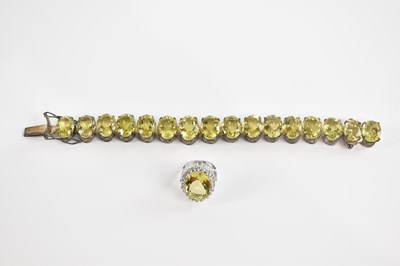 Lot 1739 - A decorative bracelet set with sixteen oval...