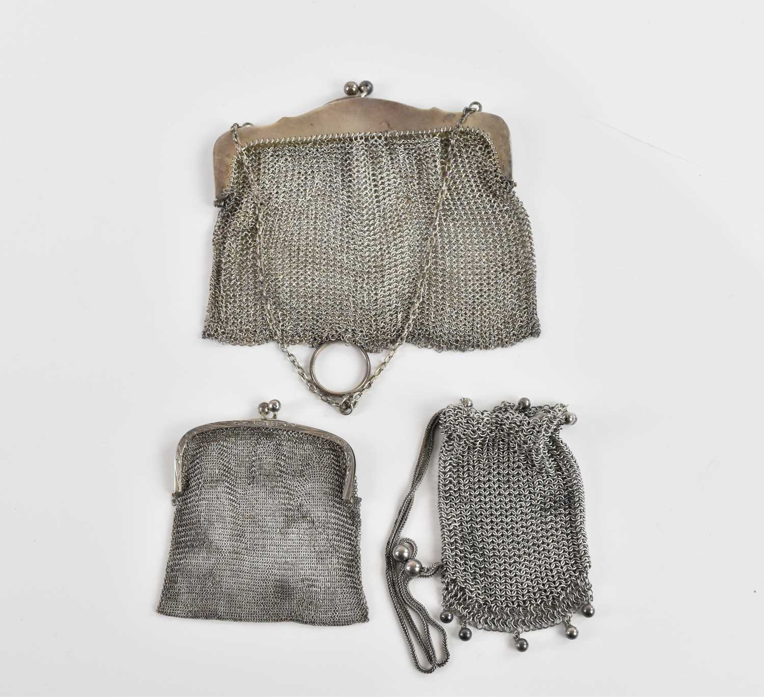 Lot 79 - Three white metal lady's mesh purses,...