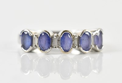 Lot 1401 - An 18ct white gold Ceylon sapphire and diamond...