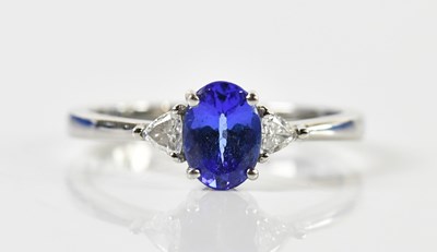 Lot 1372 - A platinum tanzanite and diamond ring, the...