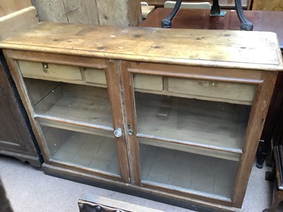 Lot 2243 - An old pine two door cabinet, on plinth base,...