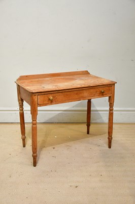 Lot 2292 - An old pine single drawer side table with...