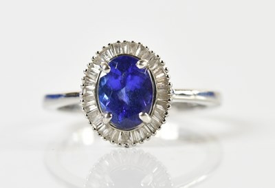 Lot 1328 - A platinum, tanzanite and diamond ring, the...