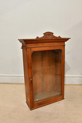Lot 2293 - A pine wall cabinet with single glazed door,...