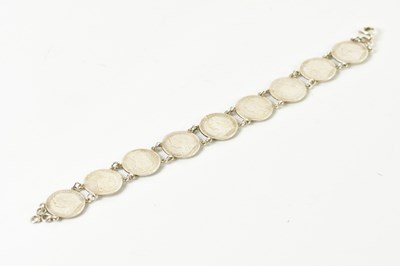 Lot 472 - A bracelet formed of threepenny bit coins, all...