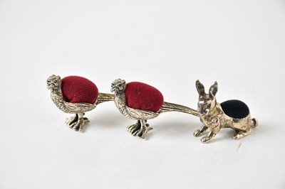 Lot 55 - A group of three pin cushions, each stamped...