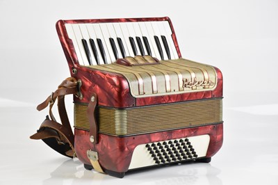 Lot 2908 - A Hohoner accordion with red marble effect...