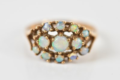 Lot 1482 - A 9ct yellow gold opal set dress ring, size M,...