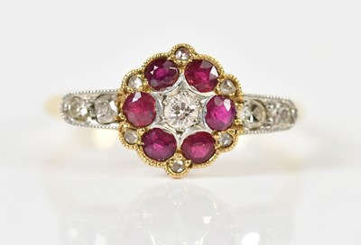 Lot 1437 - An 18ct yellow gold diamond and ruby ring,...