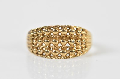 Lot 1438 - A 9ct yellow gold bead decorated ring, size O,...
