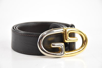 Lot 1906 - GUCCI; a vintage brown leather GG belt, with...