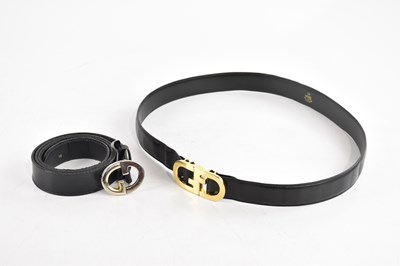 Lot 694 - GUCCI; a navy blue calfskin leather belt, with...