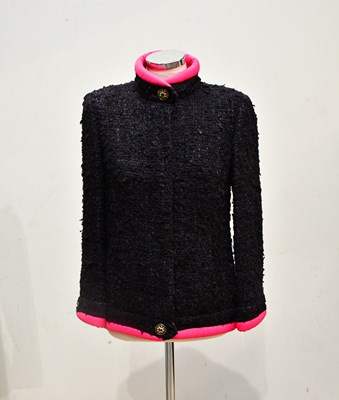 Lot 1950 - CHANEL; a black bouclé wool high neck jacket...