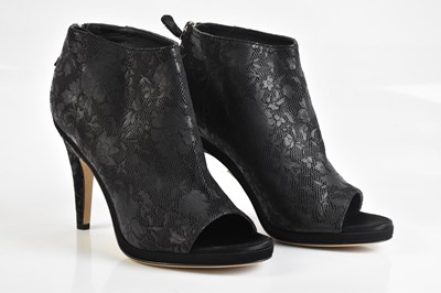 Lot 2092 - CHANEL; a pair of unused embossed Camellia...