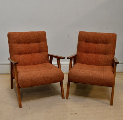 Lot 2214 - A pair of mid century style elbow chairs...
