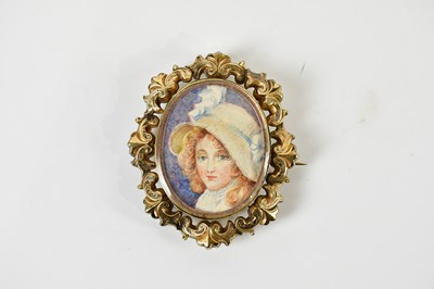 Lot 261 - A Victorian yellow metal framed oval portrait...