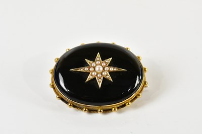 Lot 262 - A Victorian yellow metal framed black onyx and...