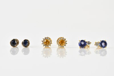 Lot 1673 - A pair of yellow metal tanzanite and diamond...