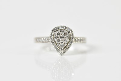 Lot 1406 - A platinum and diamond ring with heart shaped...
