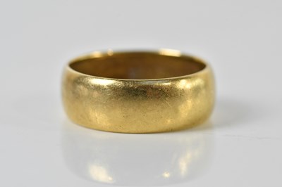 Lot 1364 - A broad 18ct yellow gold wedding band, size T,...