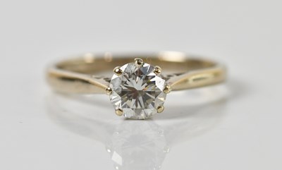 Lot 1299 - An 18ct gold diamond solitaire ring, with claw...